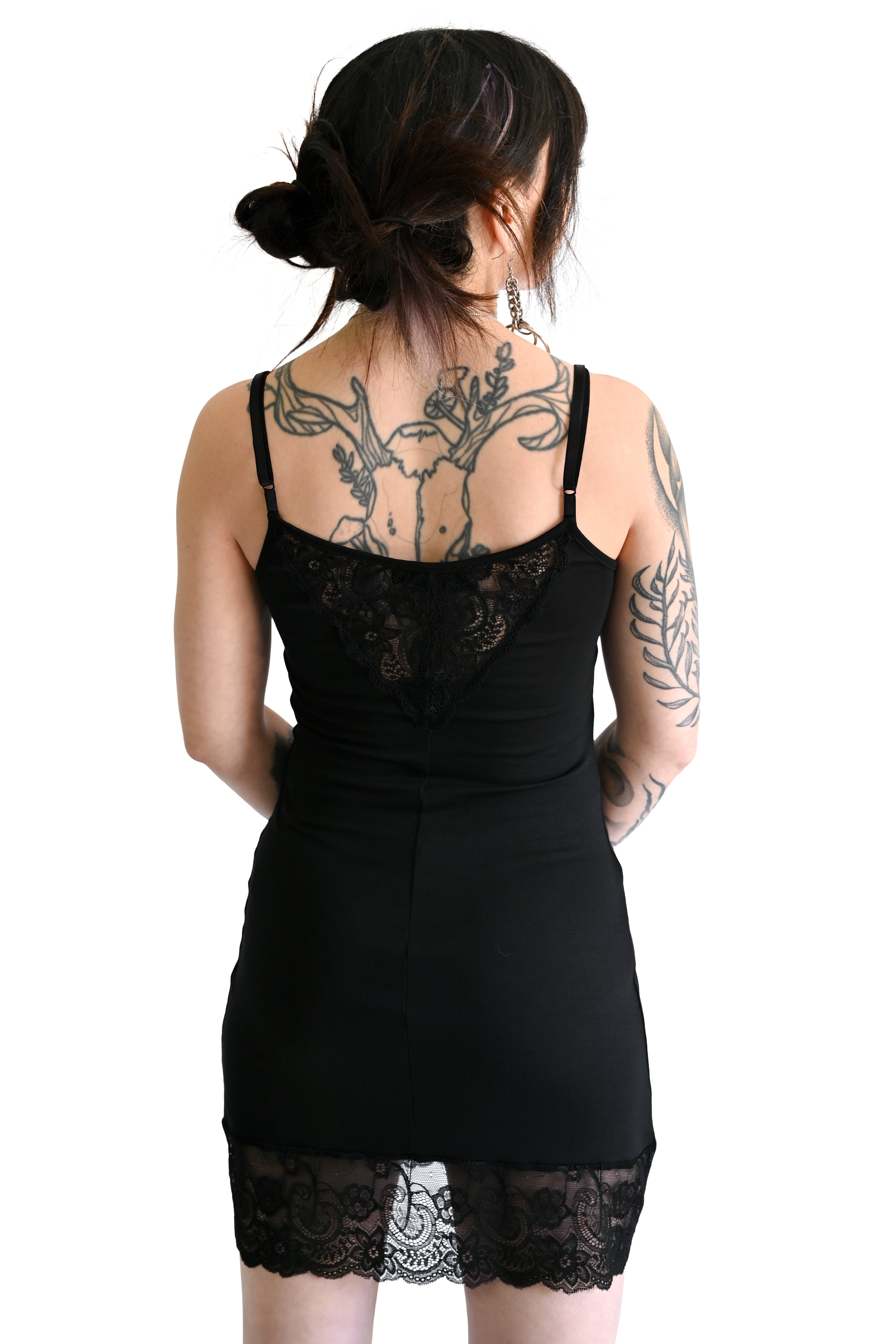 short black slip dress with lace trim and front/back lace panels