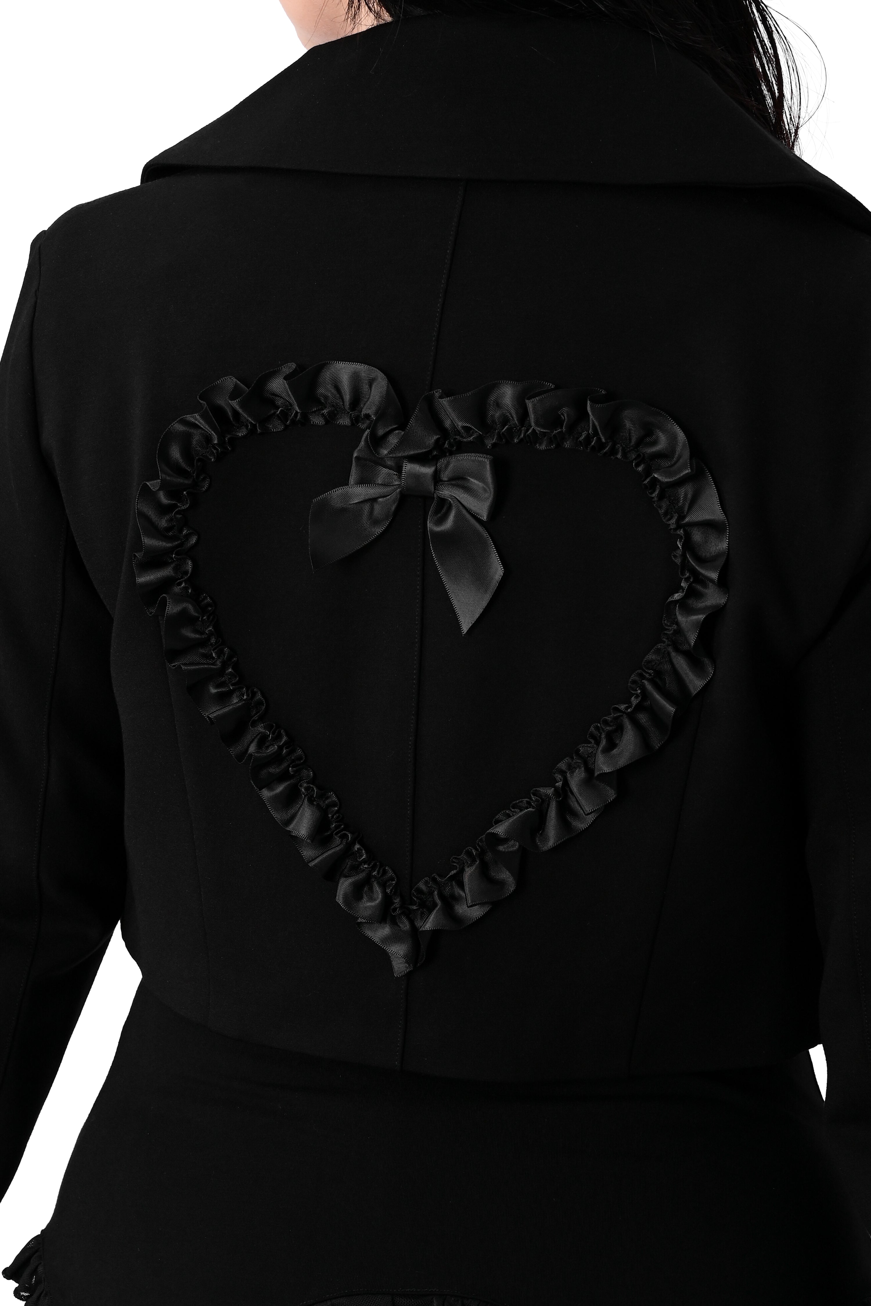 black cropped blazer with the cutest heart pockets with satin ruffle trim. matching ruffle heart on back with bow detail. two button closures on front.