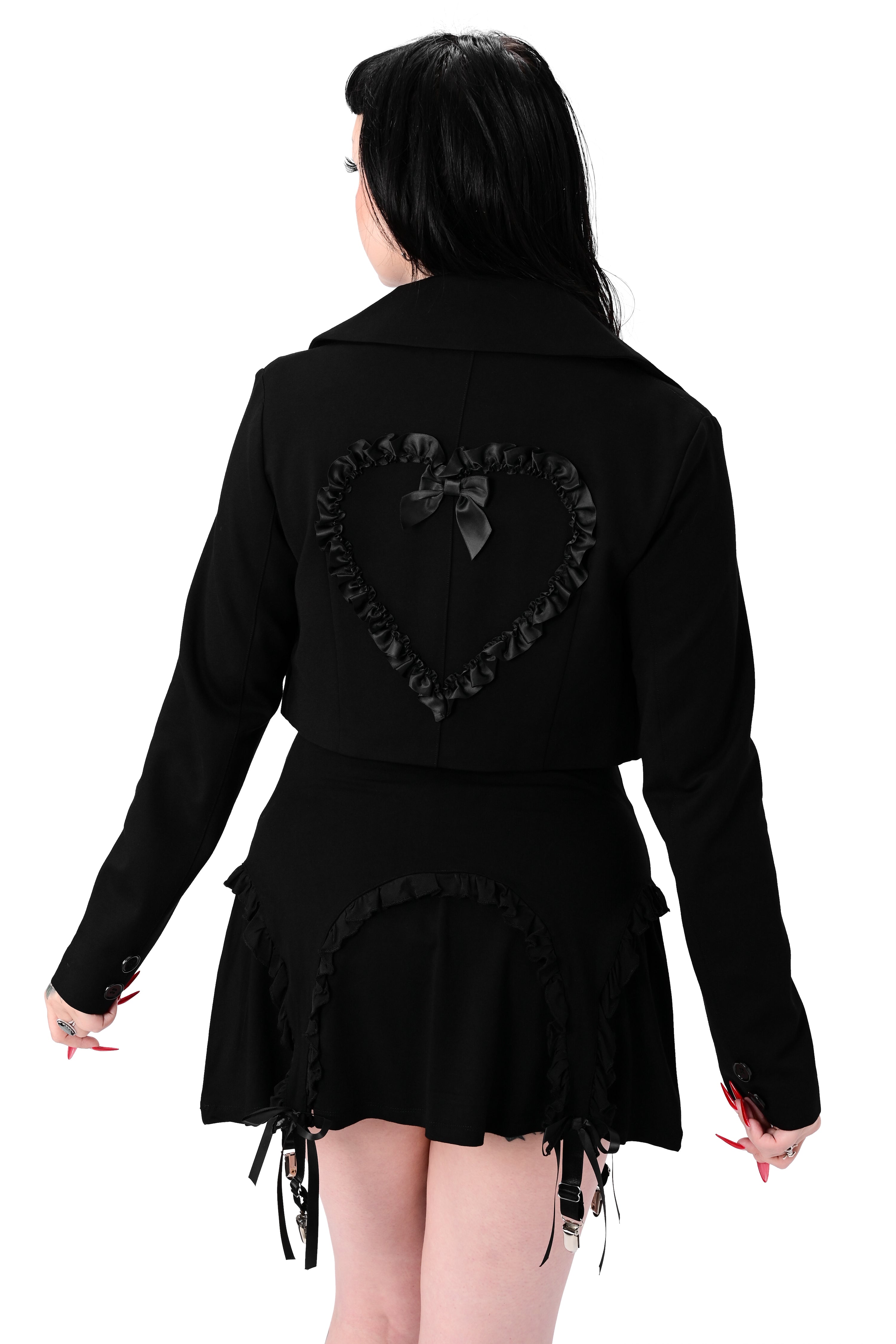 black cropped blazer with the cutest heart pockets with satin ruffle trim. matching ruffle heart on back with bow detail. two button closures on front.