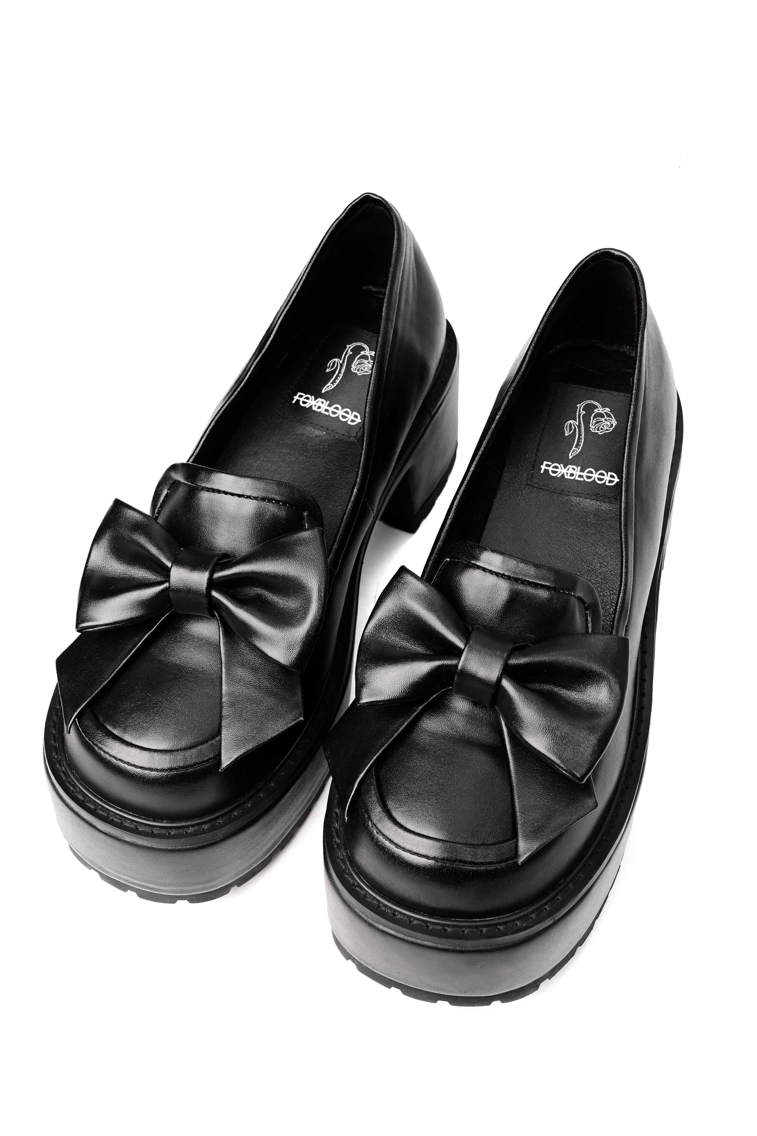black vegan leather platorm loafers with bow detail on front