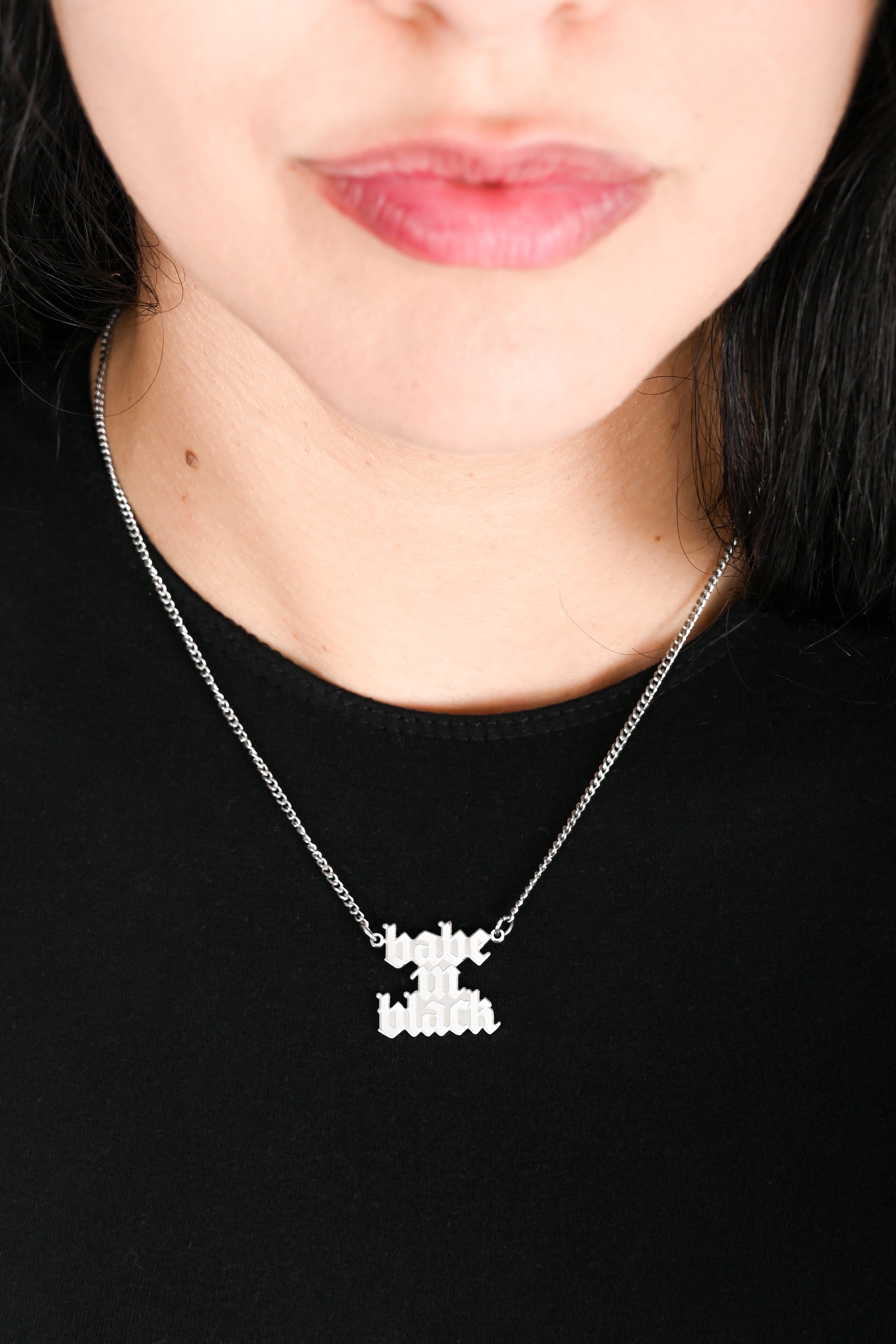 stainless steel necklace with 'babe in black' name plate