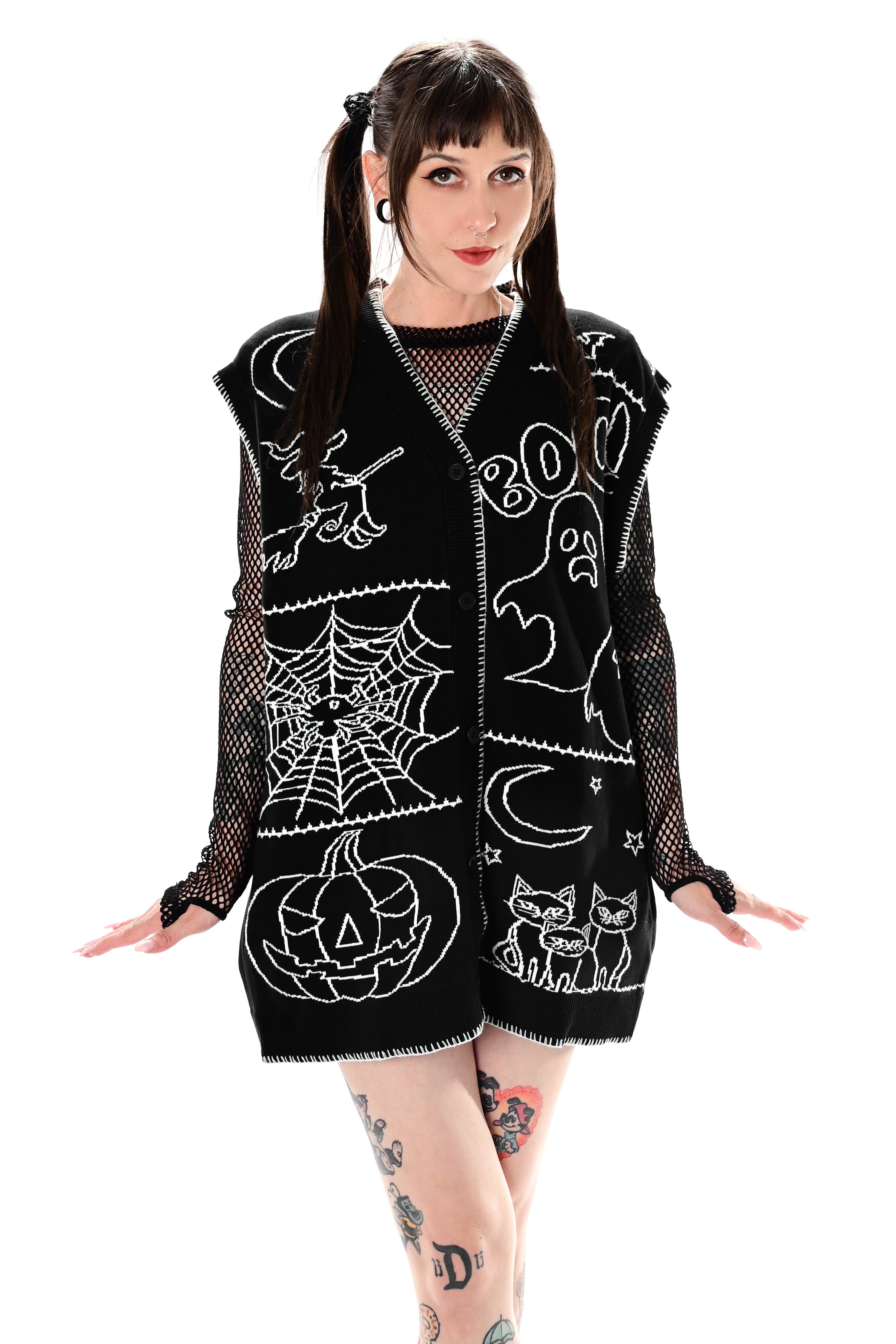 black button up sweater vest with halloween patchwork pattern and white stitching