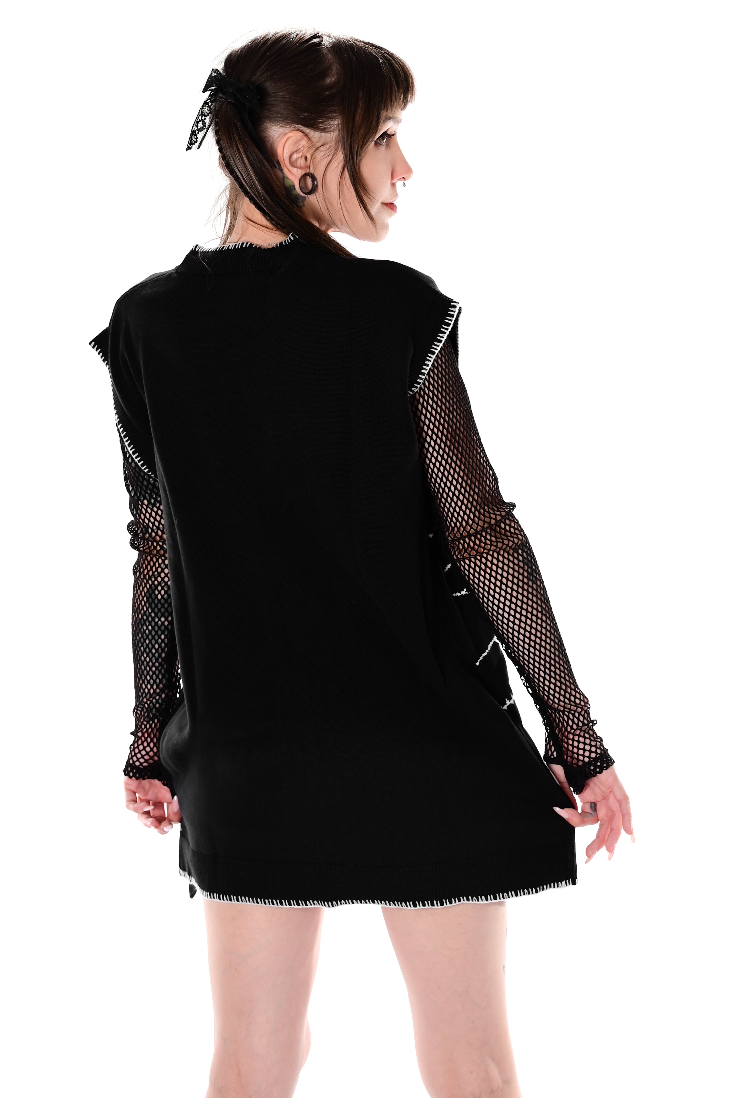 black button up sweater vest with halloween patchwork pattern and white stitching