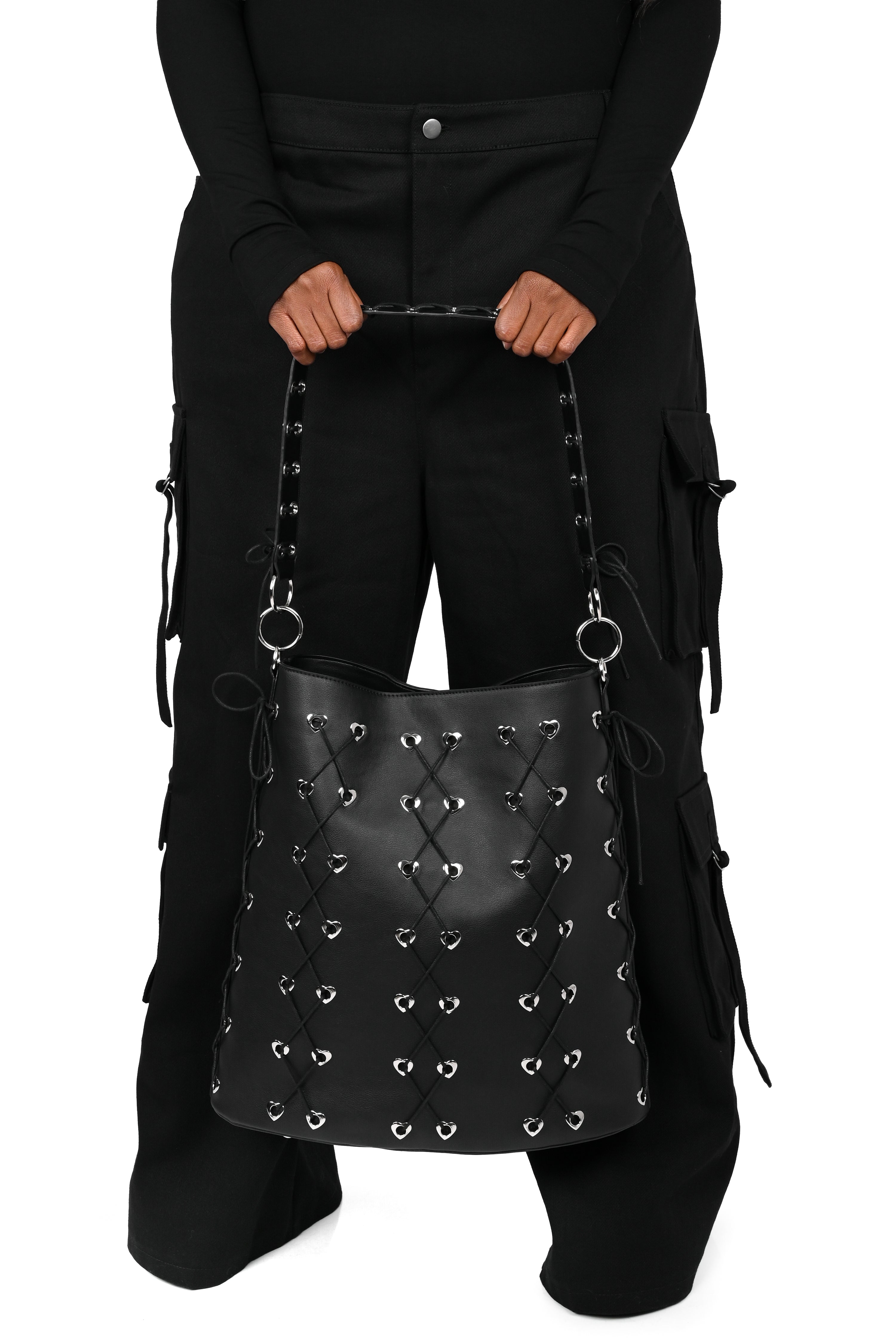 Large PU tote with heart grommets and corseted cording details.