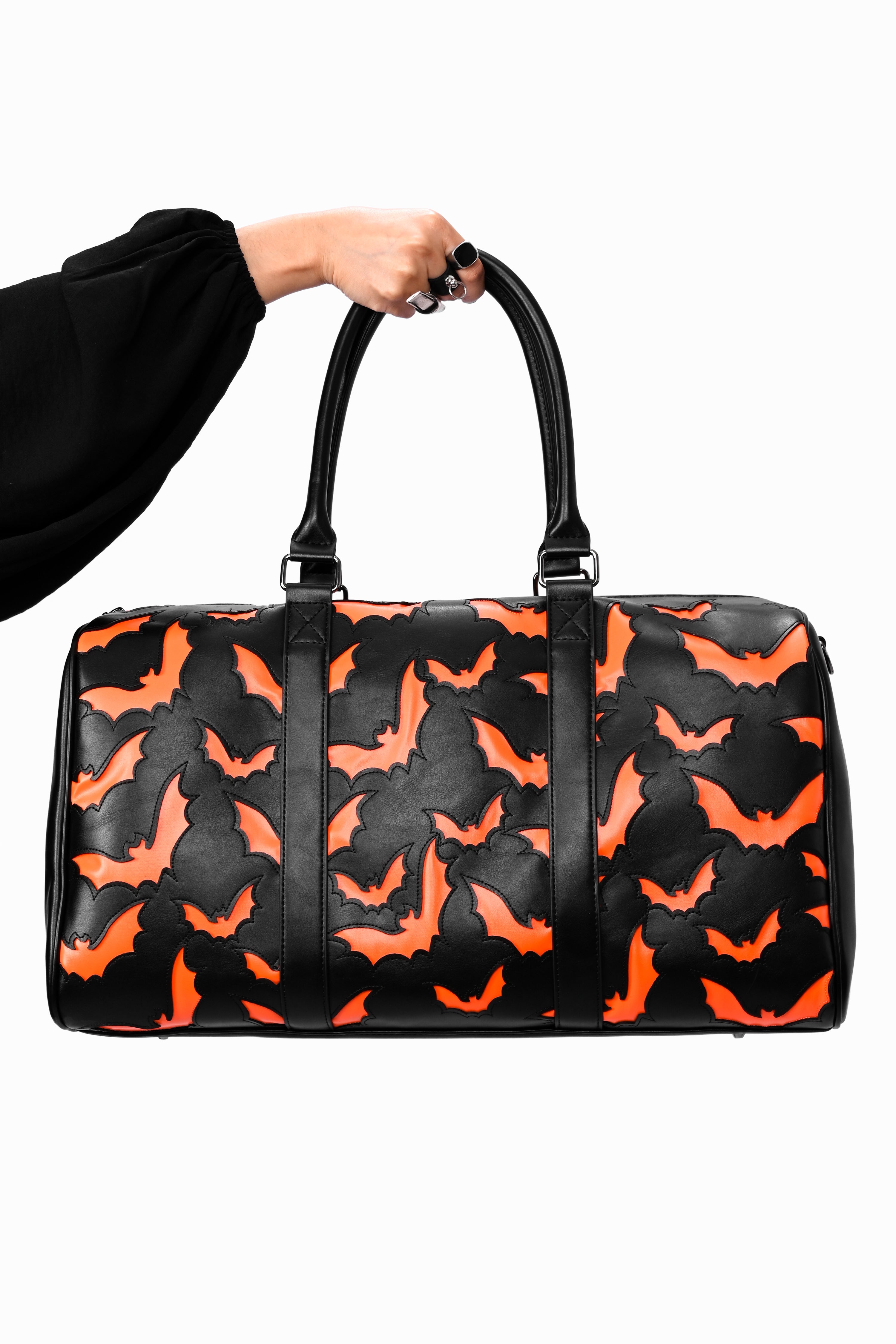 black weekender bag with orange bat underlay print