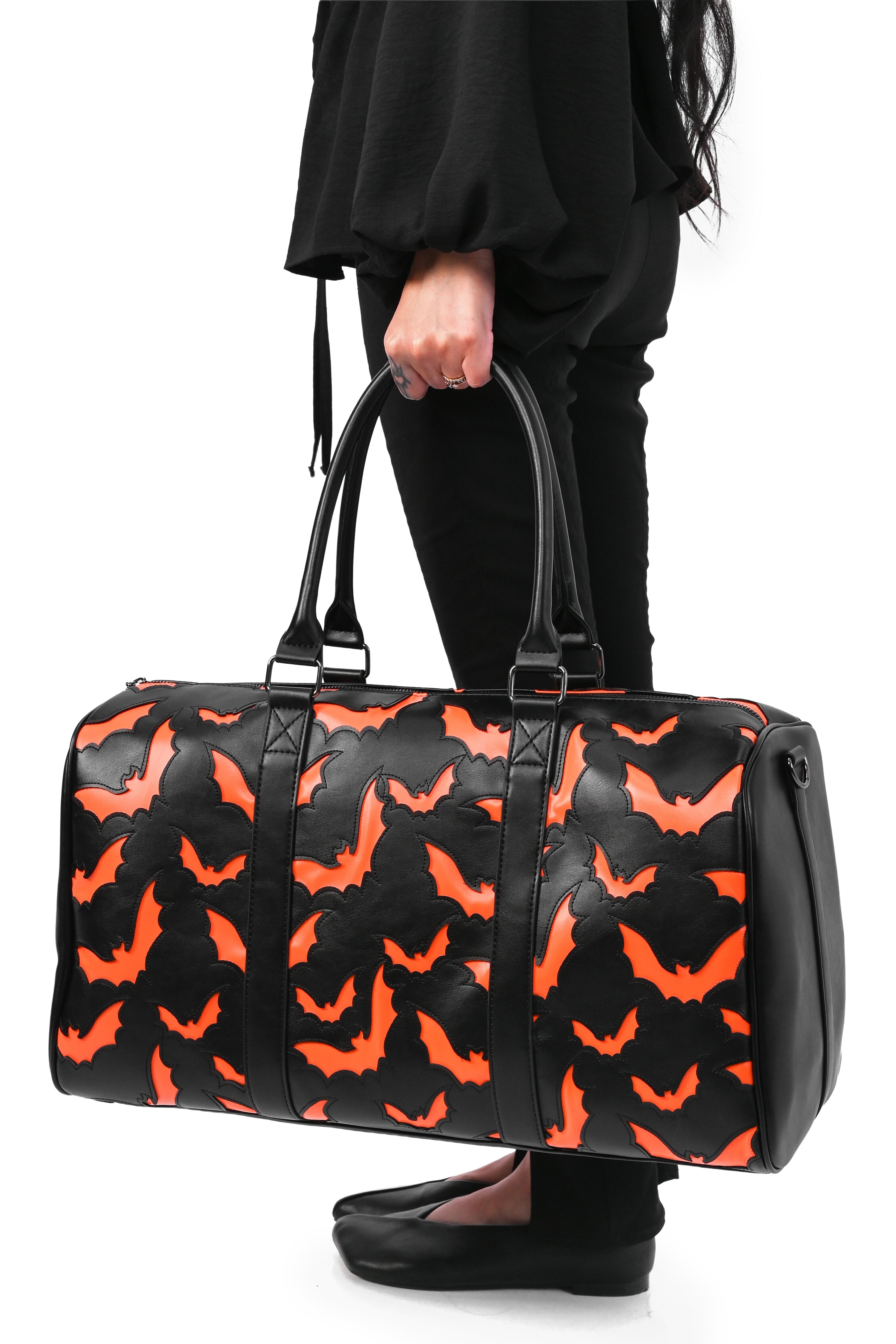 black weekender bag with orange bat underlay print