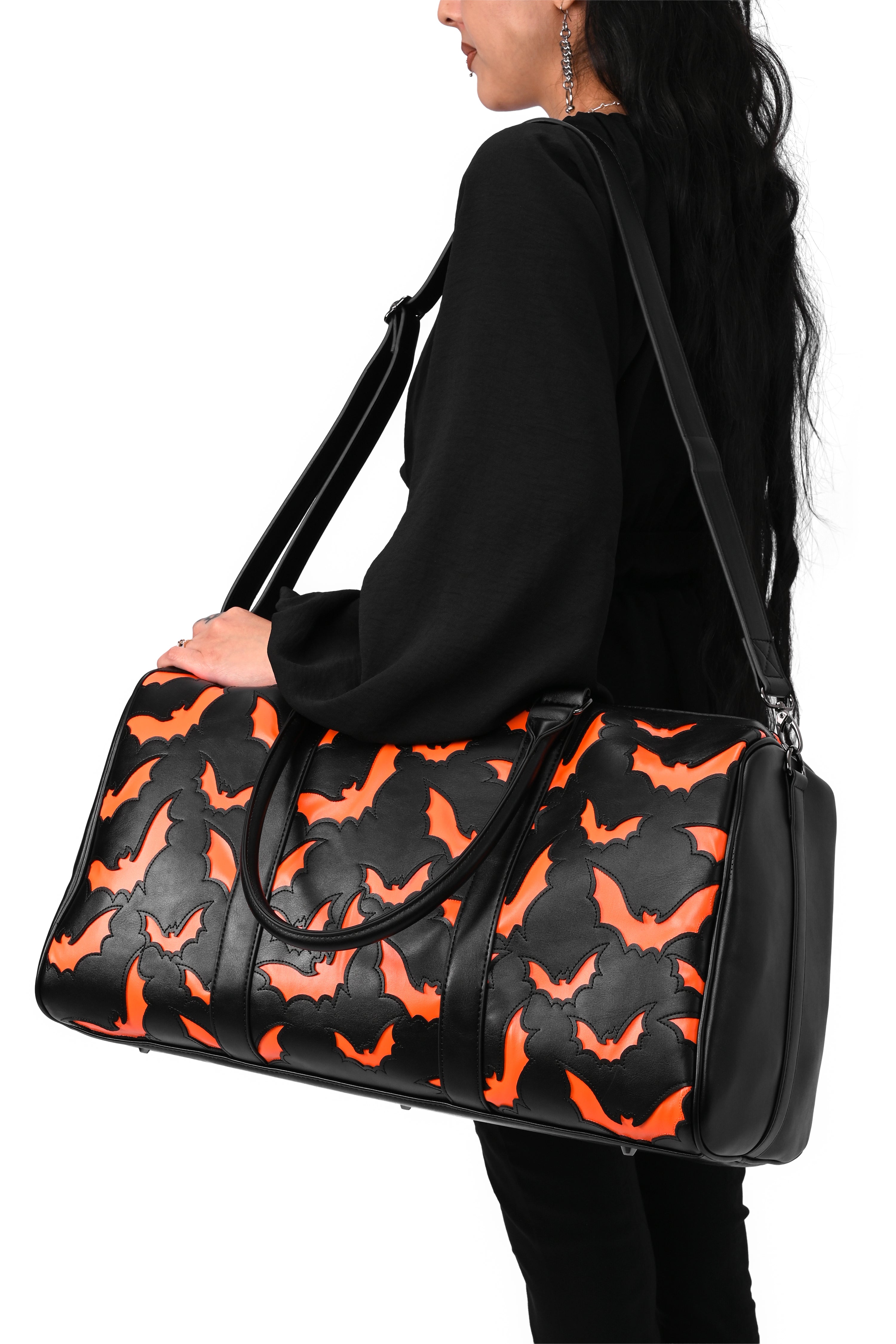 black weekender bag with orange bat underlay print