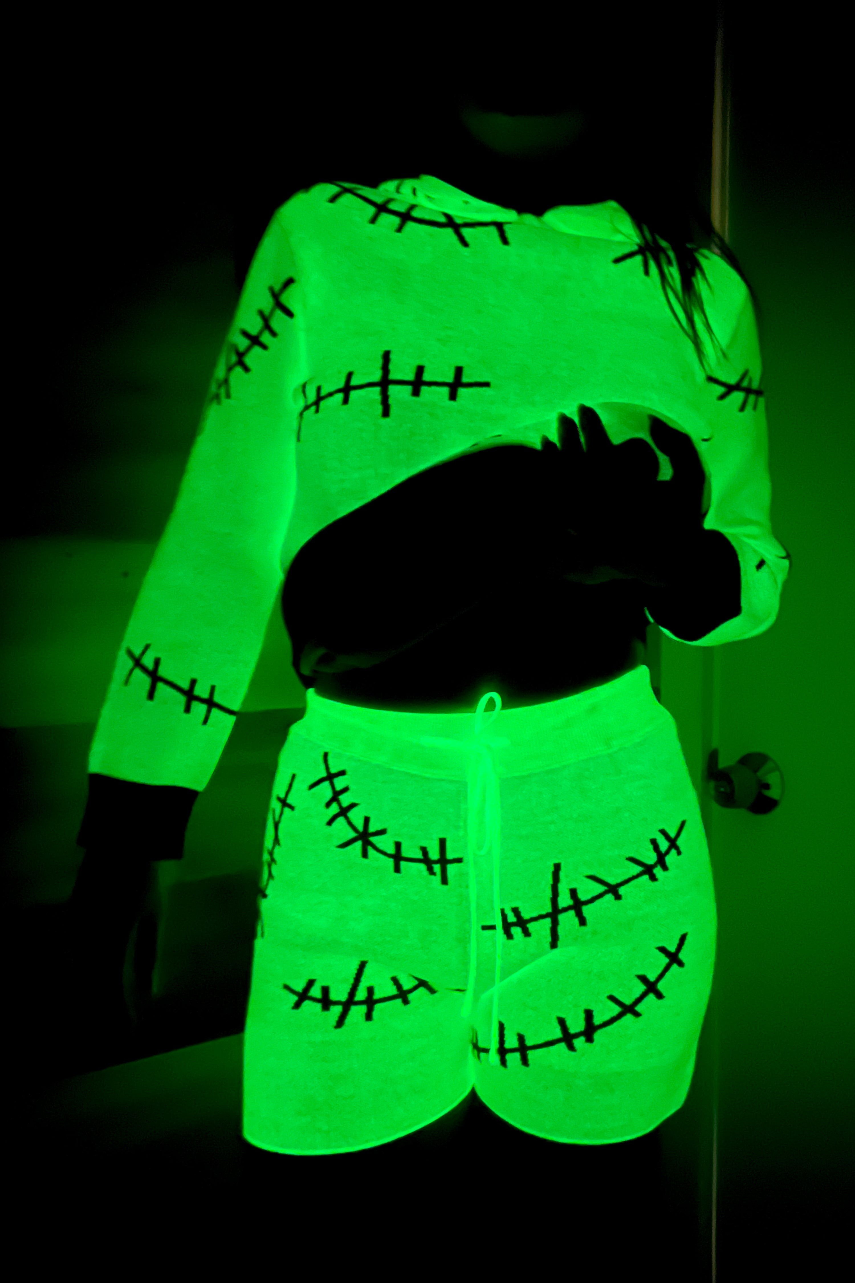 green glow in the dark shorts with black stitches pattern