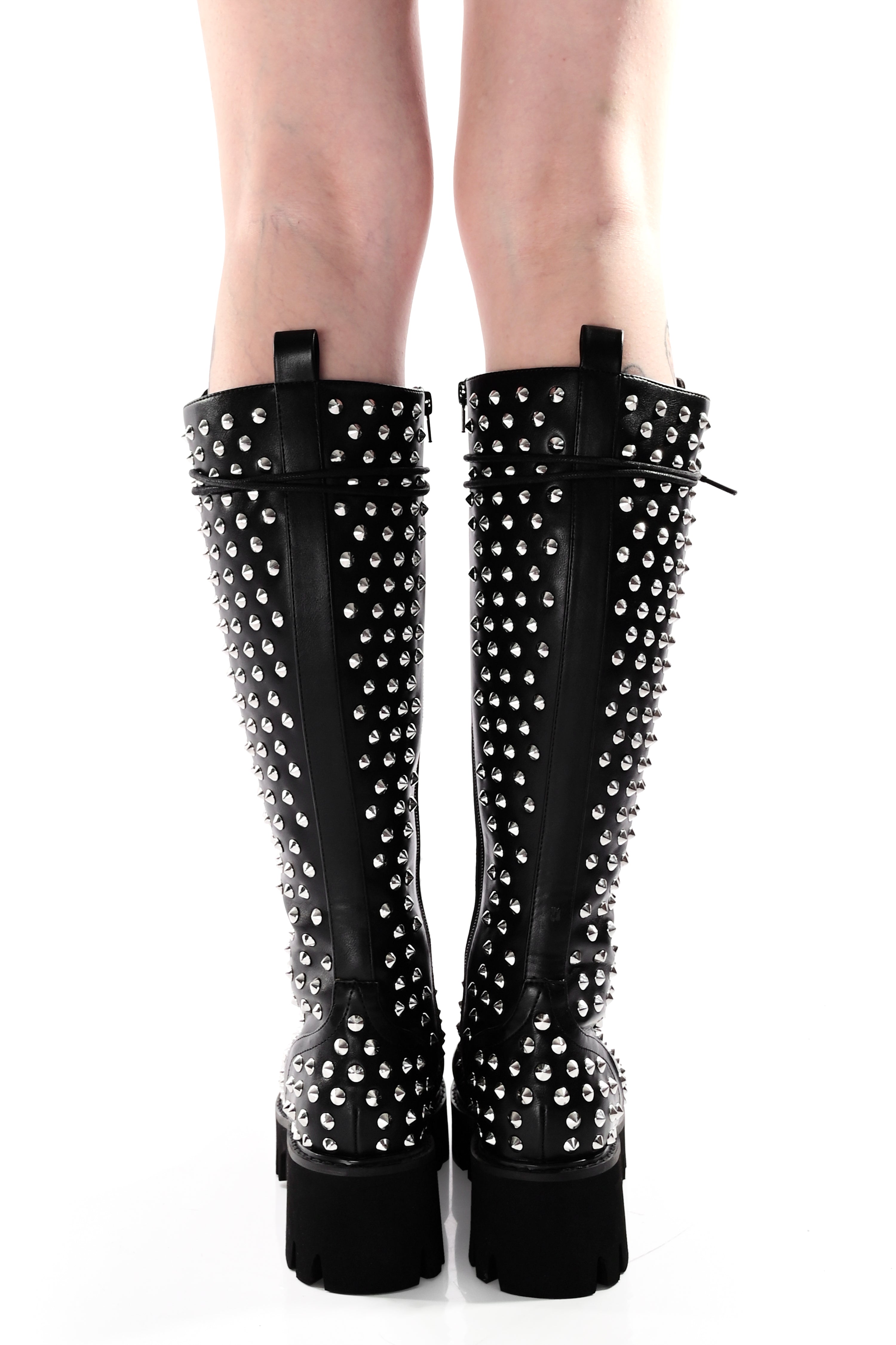 black vegan leather knee high boots covered in silver cone studs
