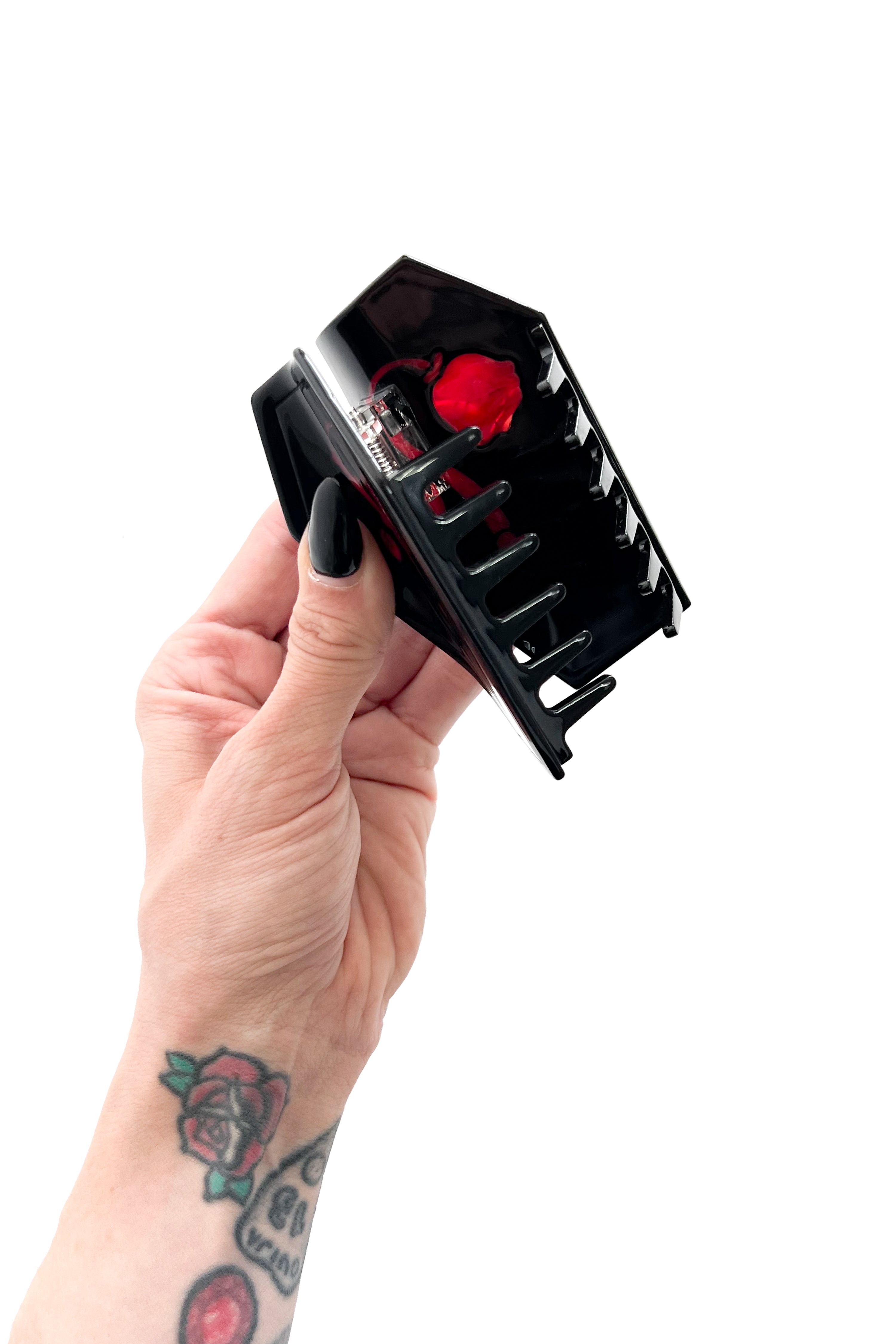 Black coffin shaped claw clip with the Foxblood Weeping Rose logo