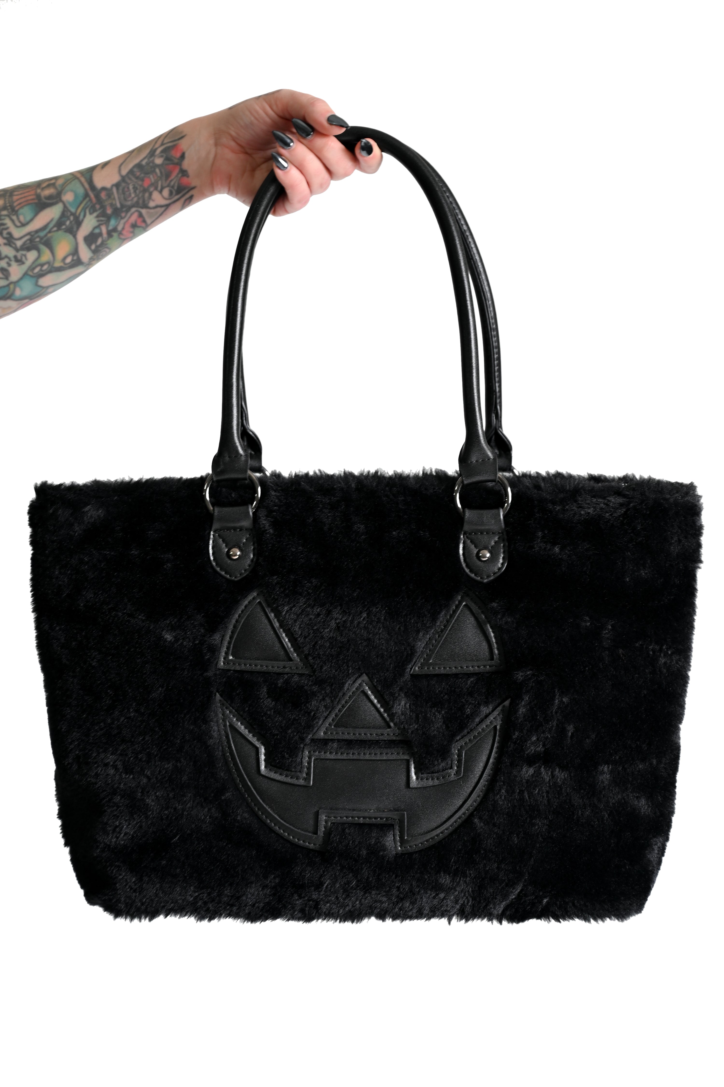 black faux fur tote bag with black jackolantern face