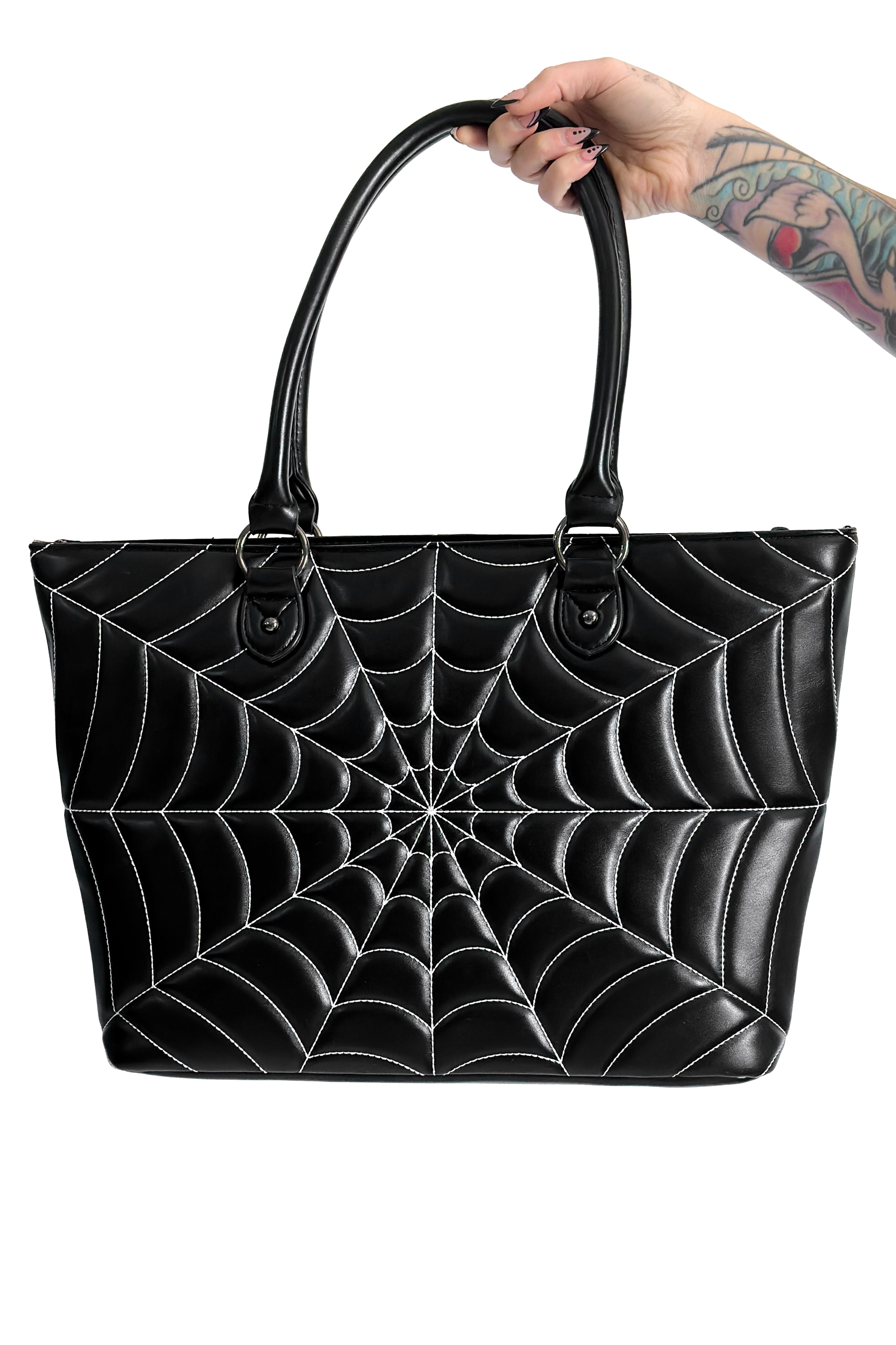 black vegan leather tote bag with white spiderweb stitch