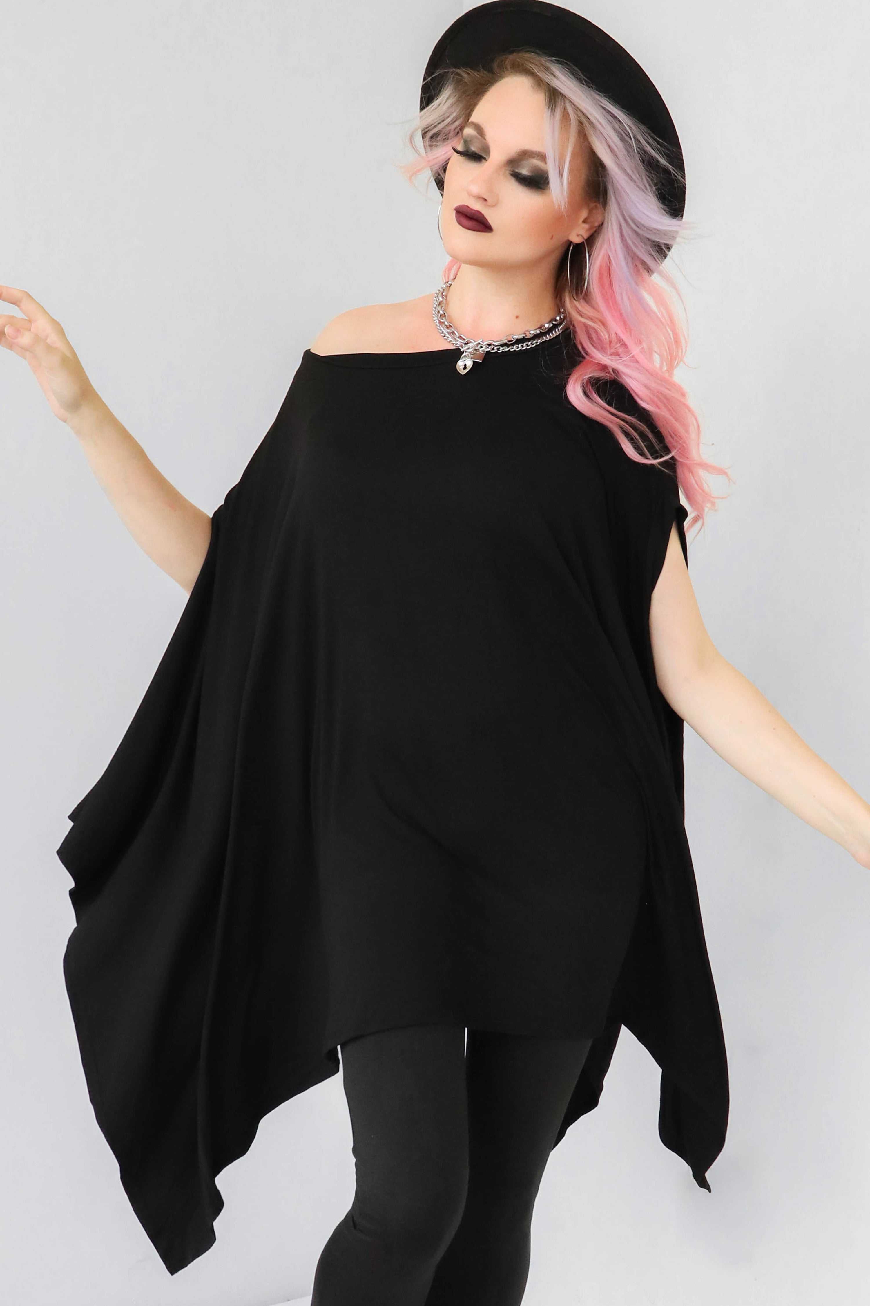 Super soft and stretchy cotton modal black tunic with draping fabric where sleeves would be