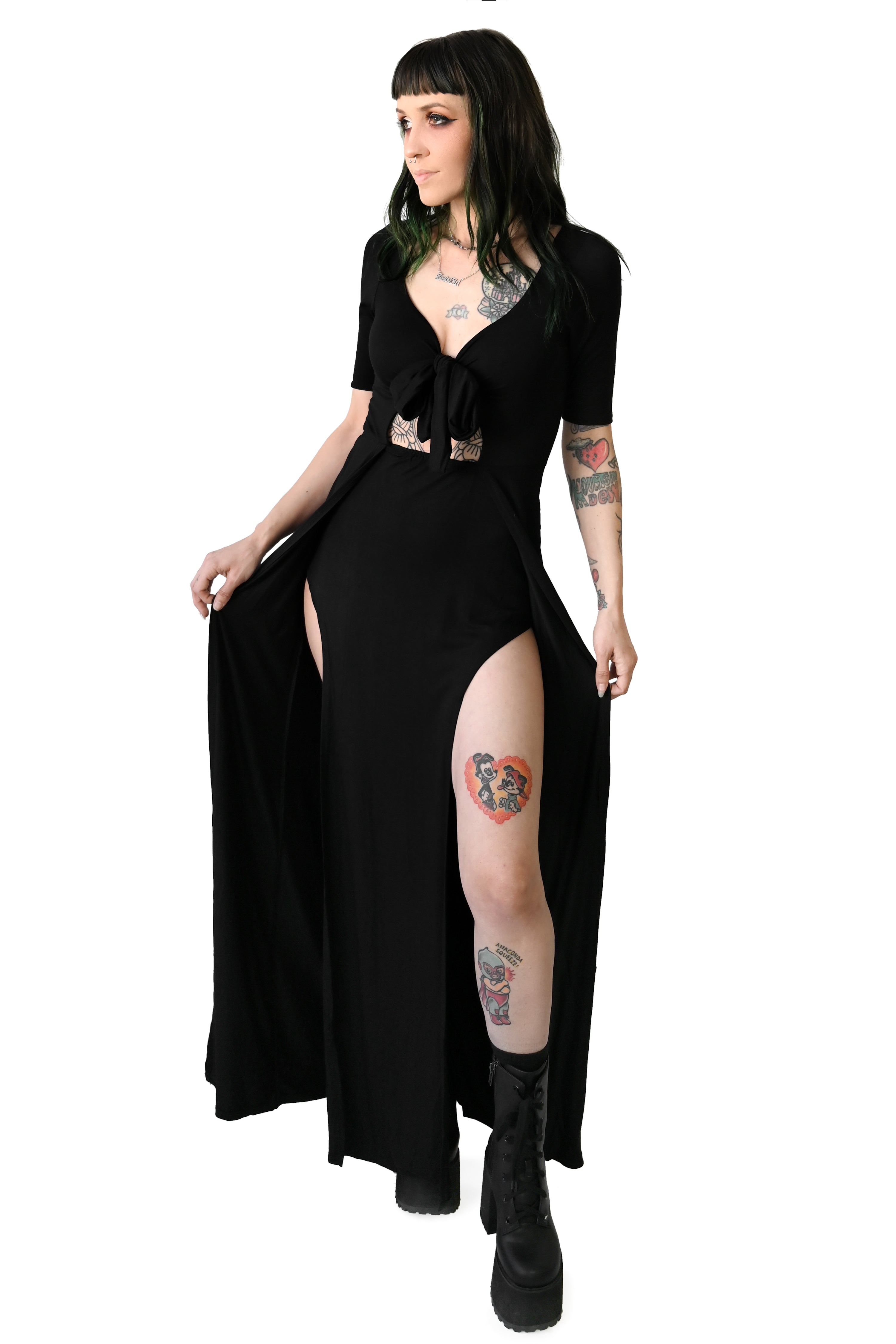 Fitted short sleeve dress with adjustable tie center front detail.   Long skirt bottom with two sky high slits in the front. 