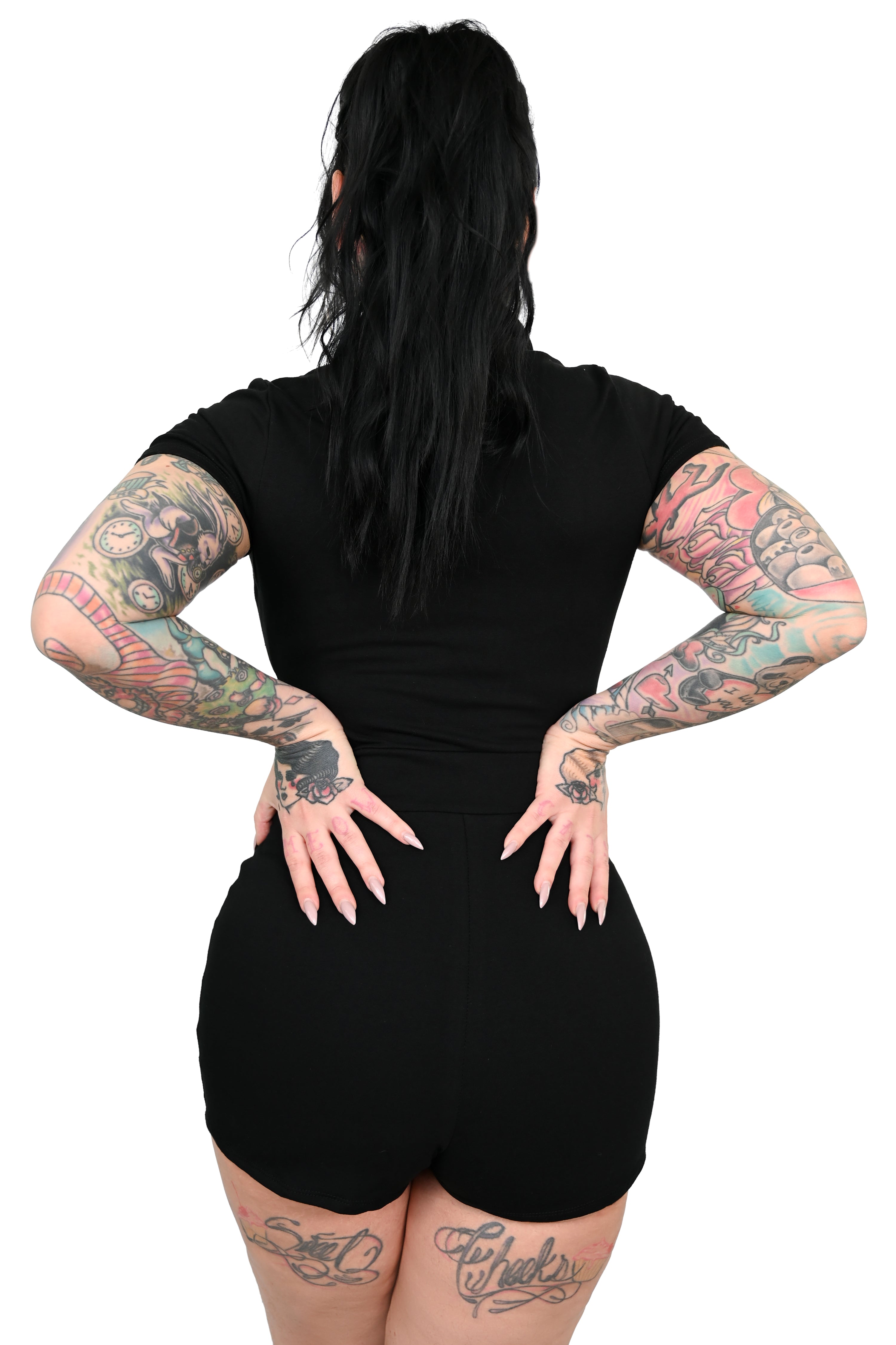 Zip up romper with deep front pockets and pointed collar.