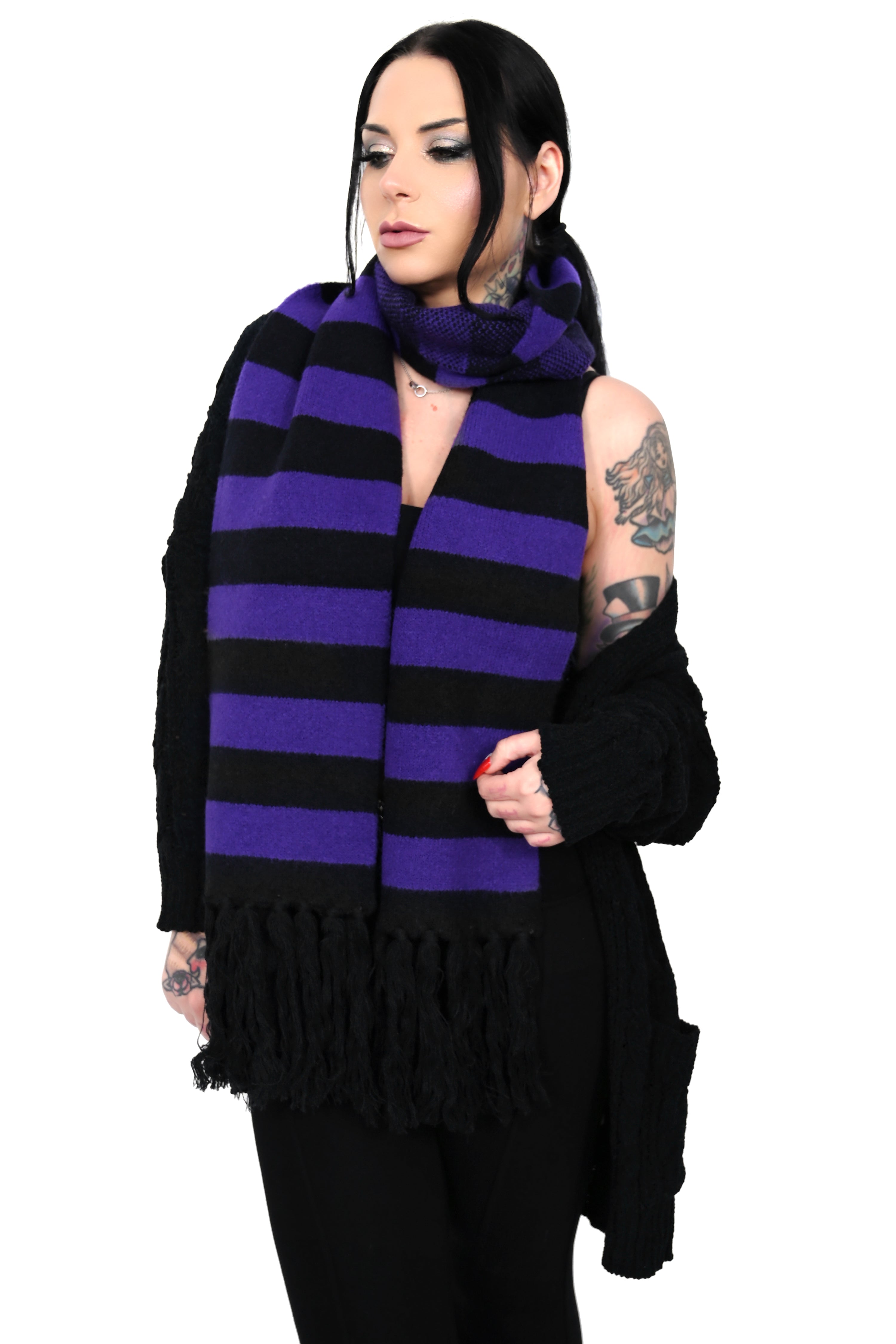 Soft black and white scarf with fringe ends.
