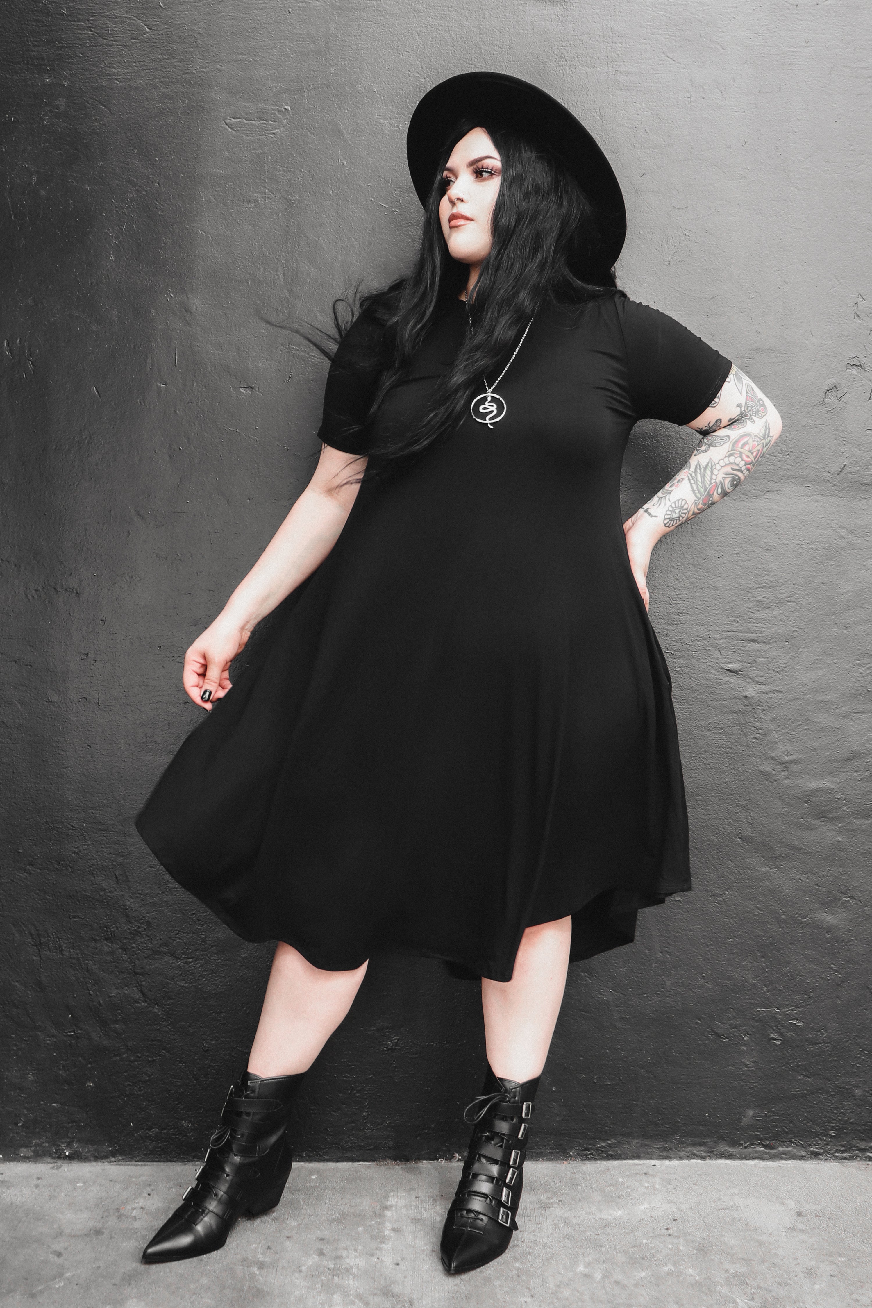 black mid length swing dress with pockets 