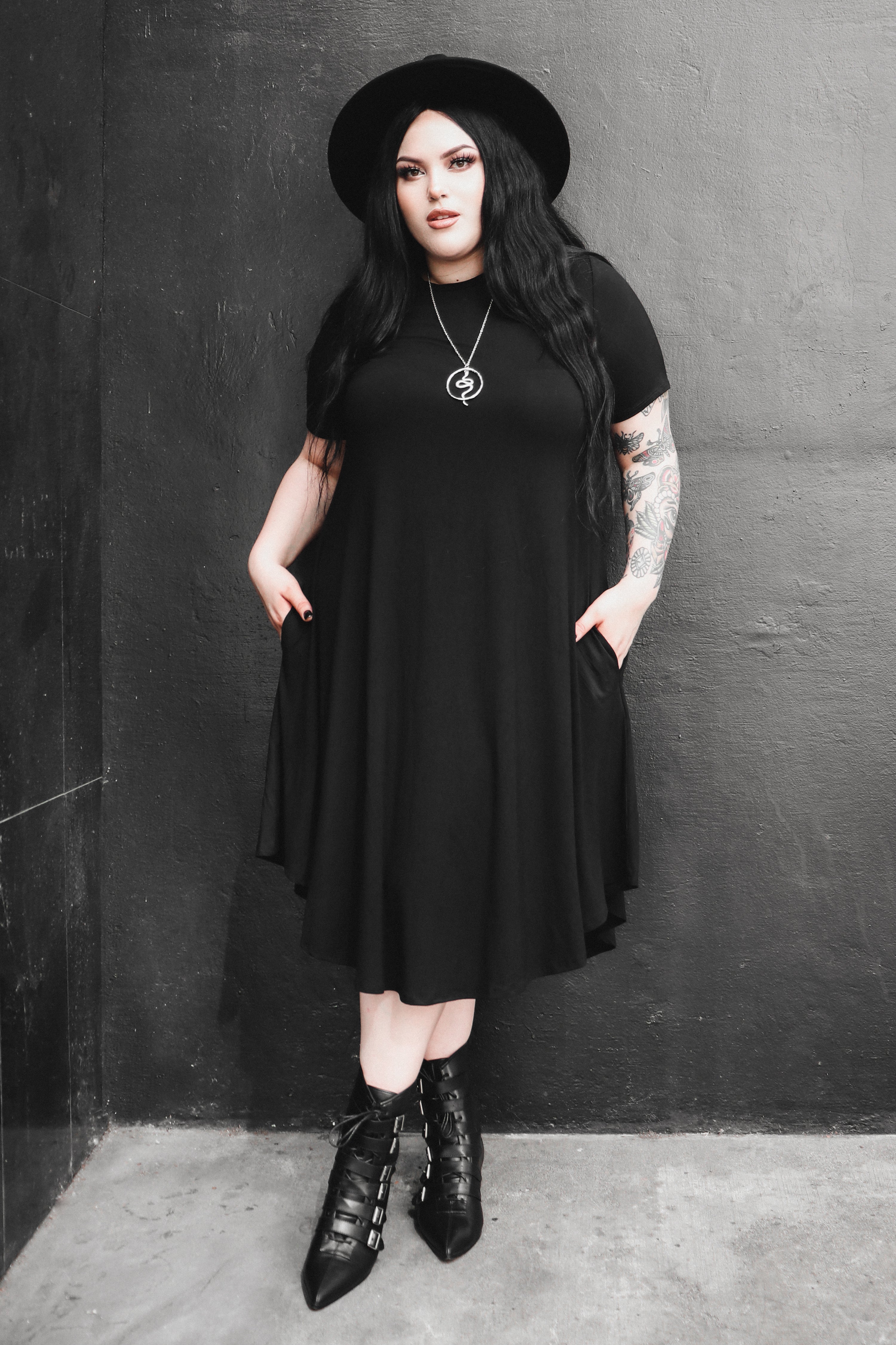 black mid length swing dress with pockets 